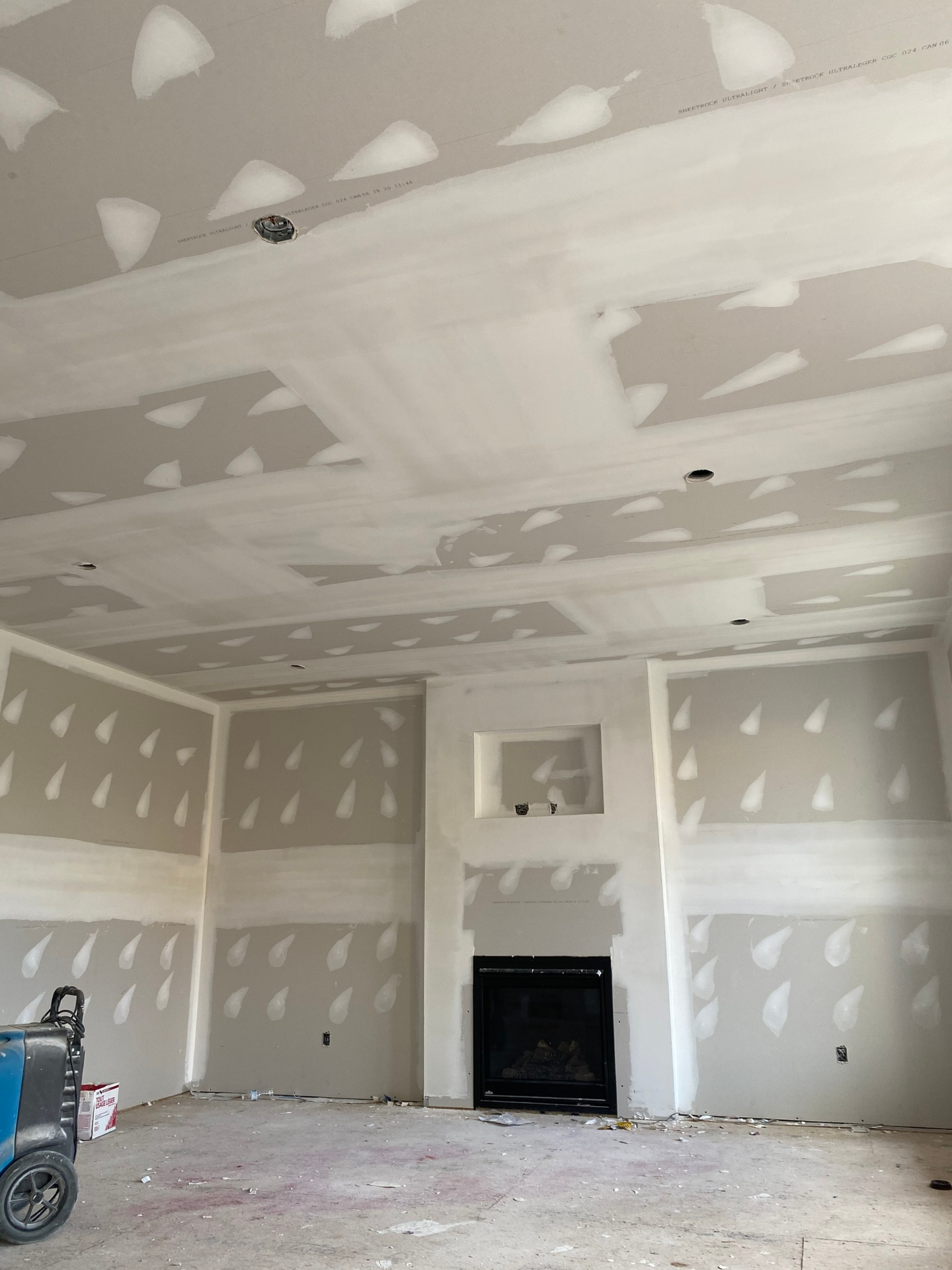 Taped and mudded ceiling with fireplace feature wall