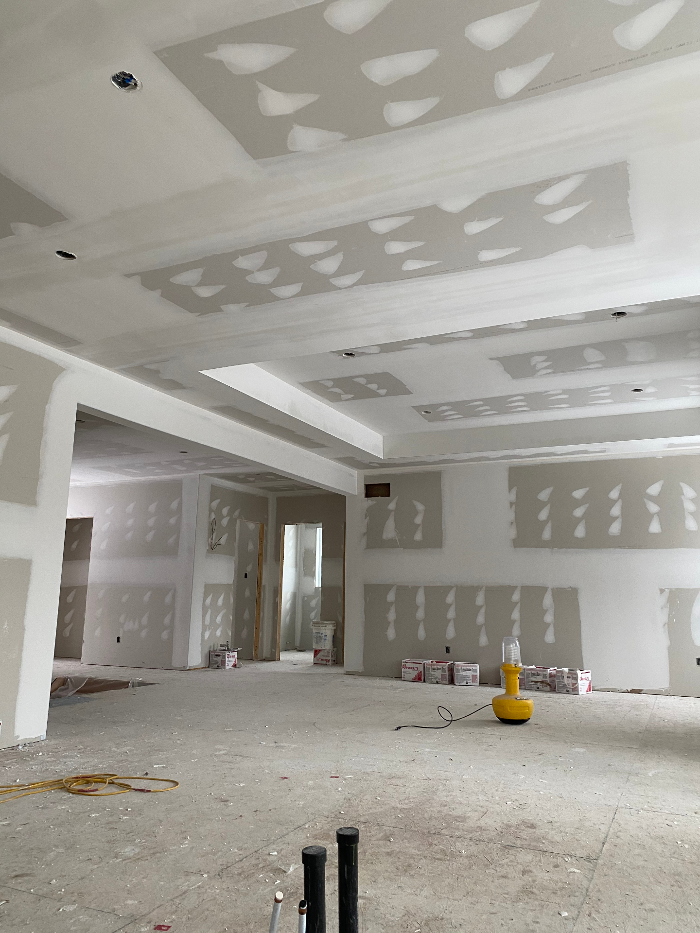 Open-concept main floor with coffered ceiling detail