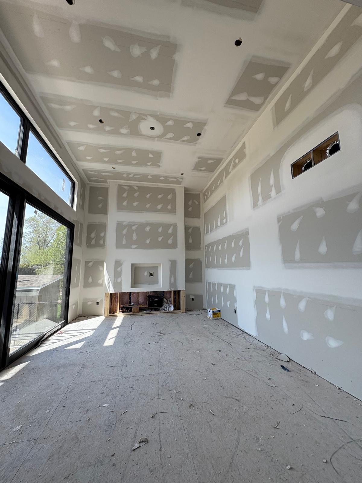 Two-storey feature wall with fireplace opening